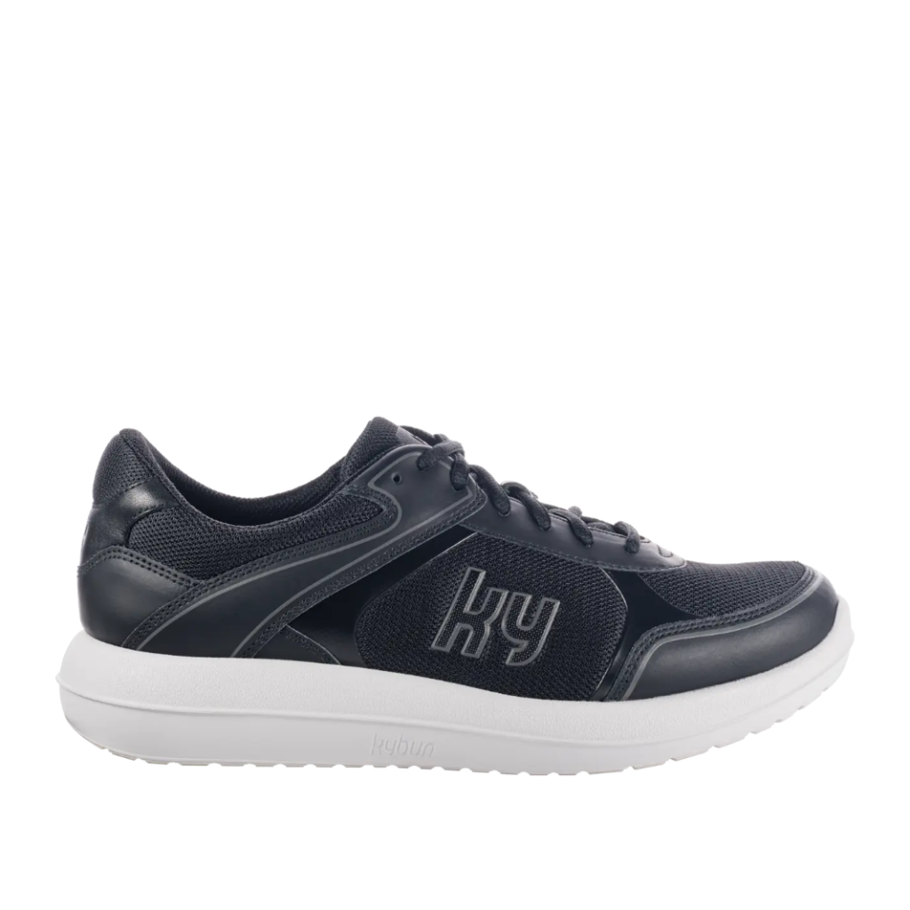 Navy blue athletic shoe with white sole on a white background